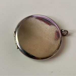Big round sterling silver antique locket.